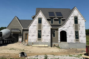 hidden-pastures-residence-driftwood-shingle-black-metal-roof